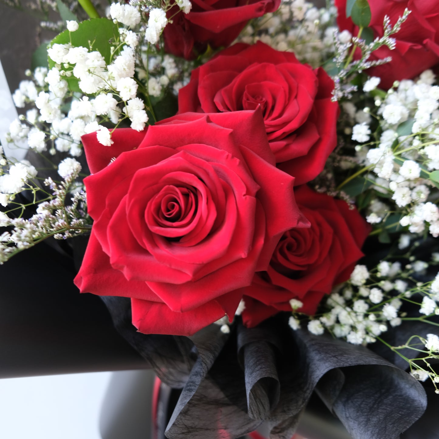 Premium red roses in a beautifully hand-tied bouquet available for delivery in Jakarta, Bintaro, Tangerang, and Cirebon.