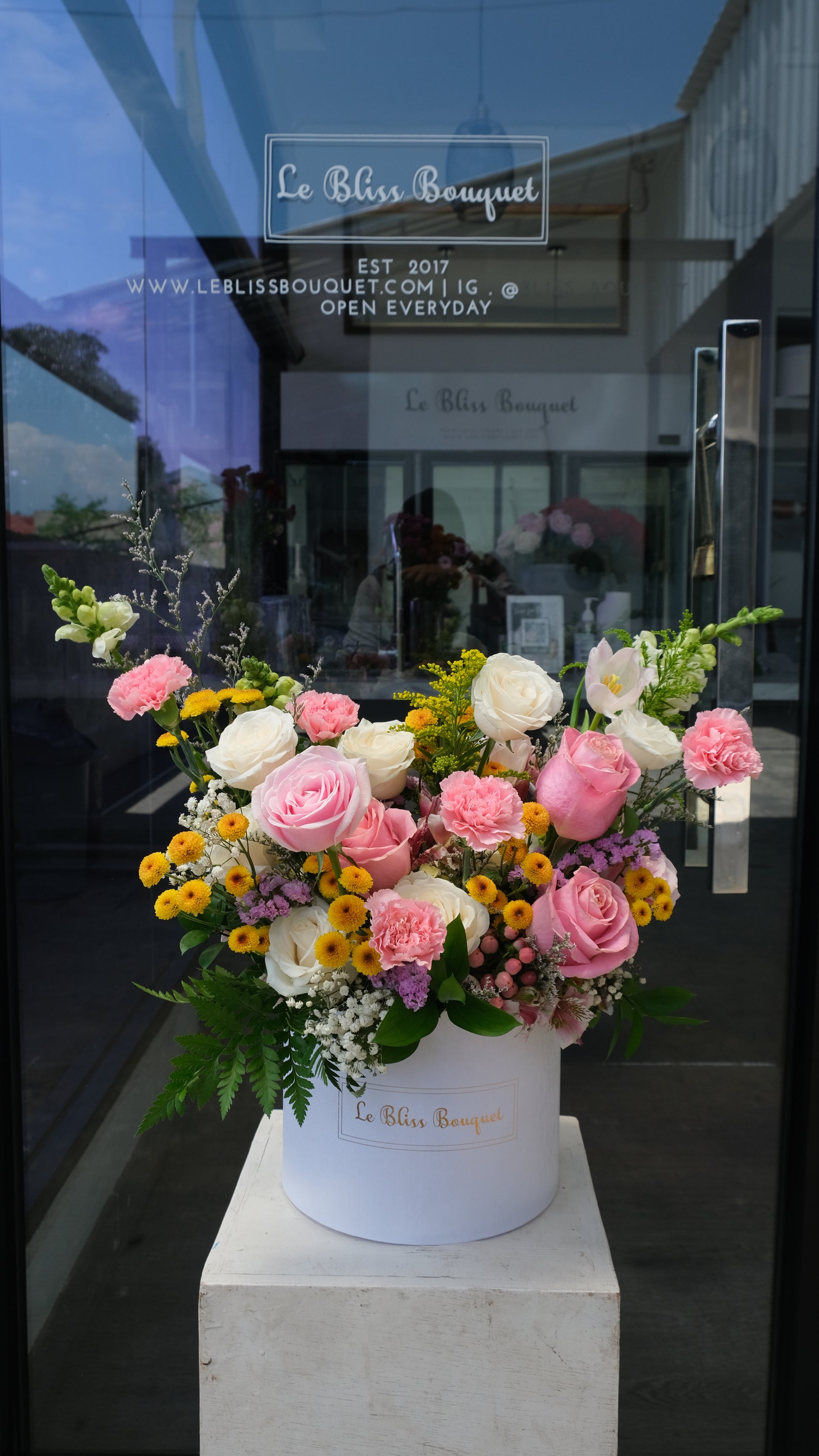 Bouquet of flowers on a marble pedestal with a blurred background. jakarta florist