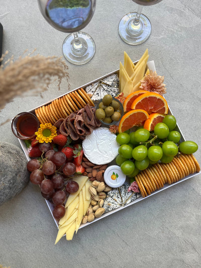 Charcuterie board with assorted meats, cheeses, and olives in Jakarta