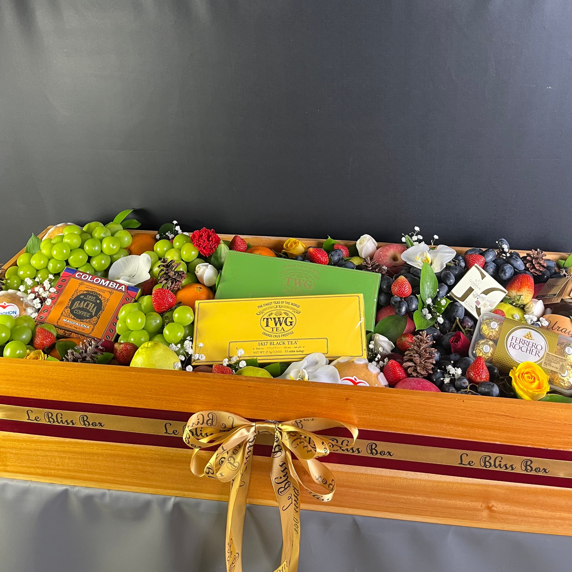 Parcel Buah besar dengan kombinasi twg tea, bacha coffee, Godiva chocolate, Ferrero, in a wooden box by Le bliss box. Grand fruit hamper