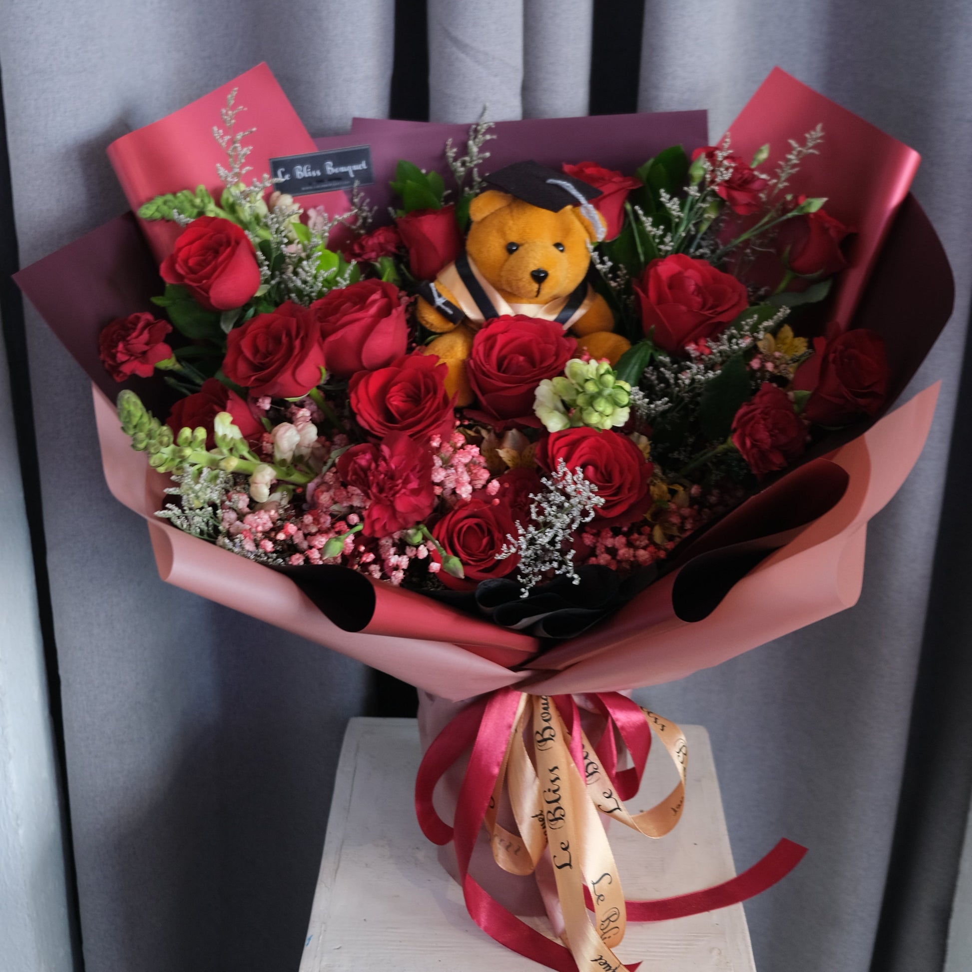 red roses graduation bouquet by le bliss bouquet. buket bunga merah by le bliss. florist jakarta, florist tangerang, florist cirebon, florist surabaya
